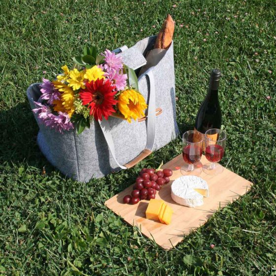 picnic tote charcuterie board with wine and cheese
